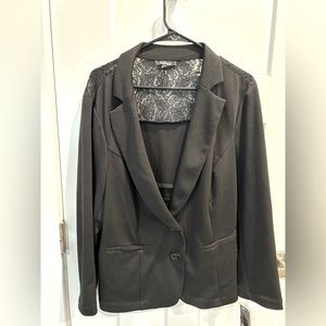 This a black AGB women blazer with lace on upper back. Tags are attached